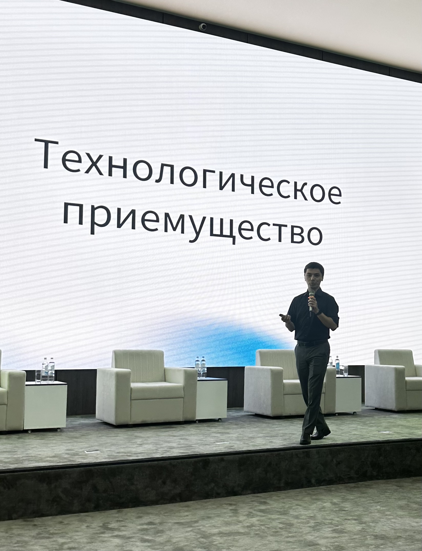 Manuchehr Ghafforzoda presenting on stage